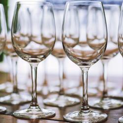 Empty wine glasses on a wooden table - crop ofPhoto by Kaboompics .com from Pexels